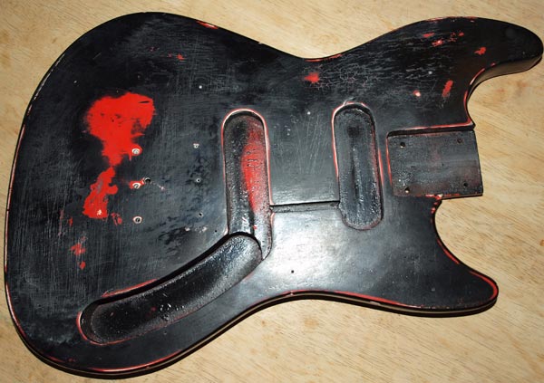 One of the best reasons to refinish a guitar is to a cover a previous poor refinish
